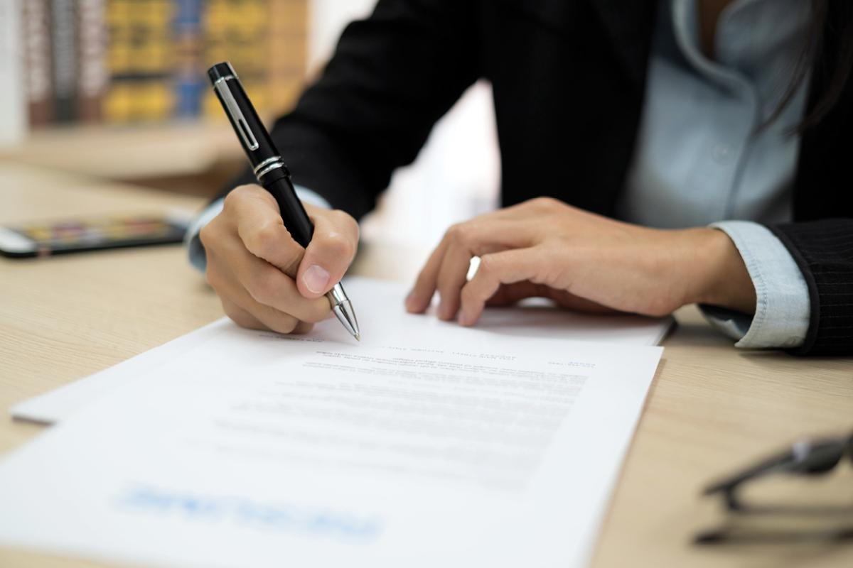 Person signing a contract