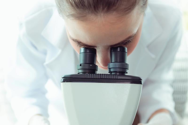 Woman using a microscope