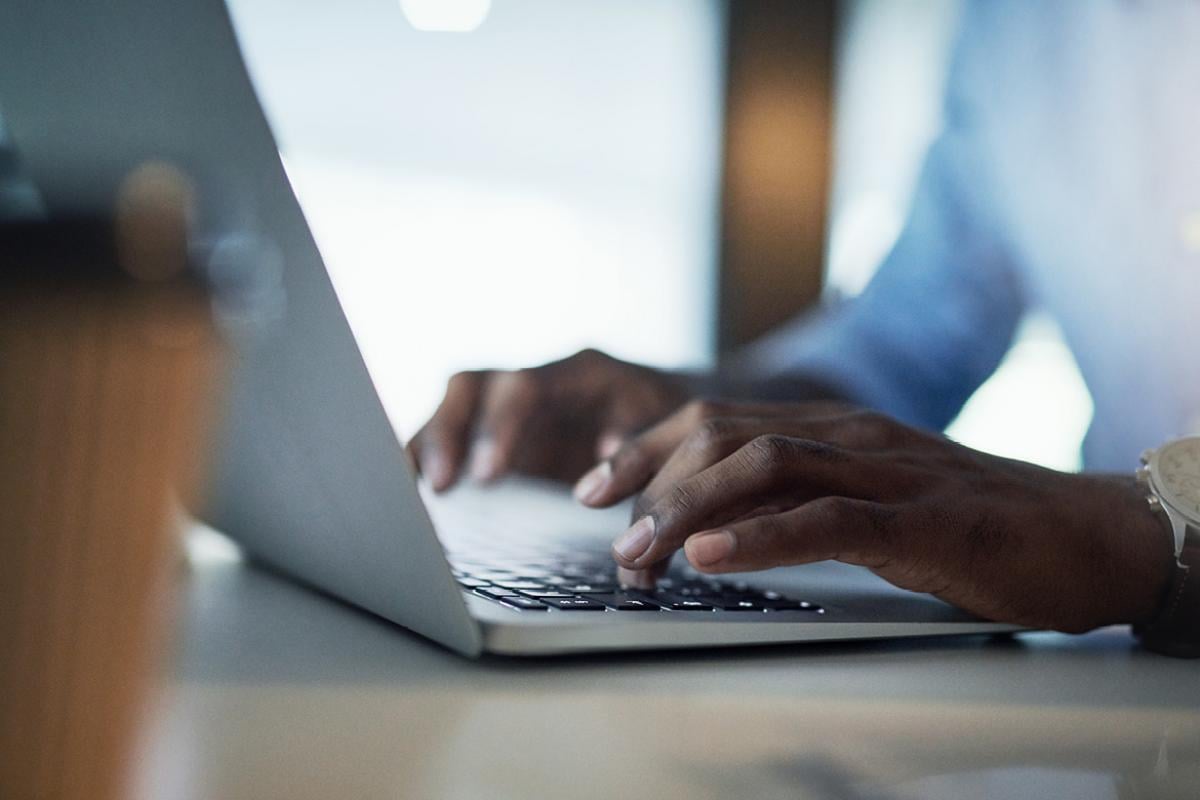 Hands on a laptop
