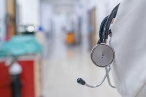 Physician holding a stethoscope