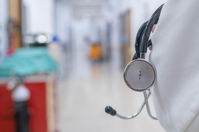 Physician holding a stethoscope