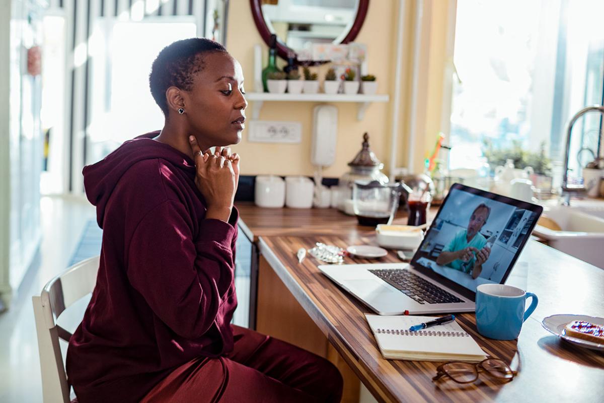 Patient and physician in a telehealth appointment