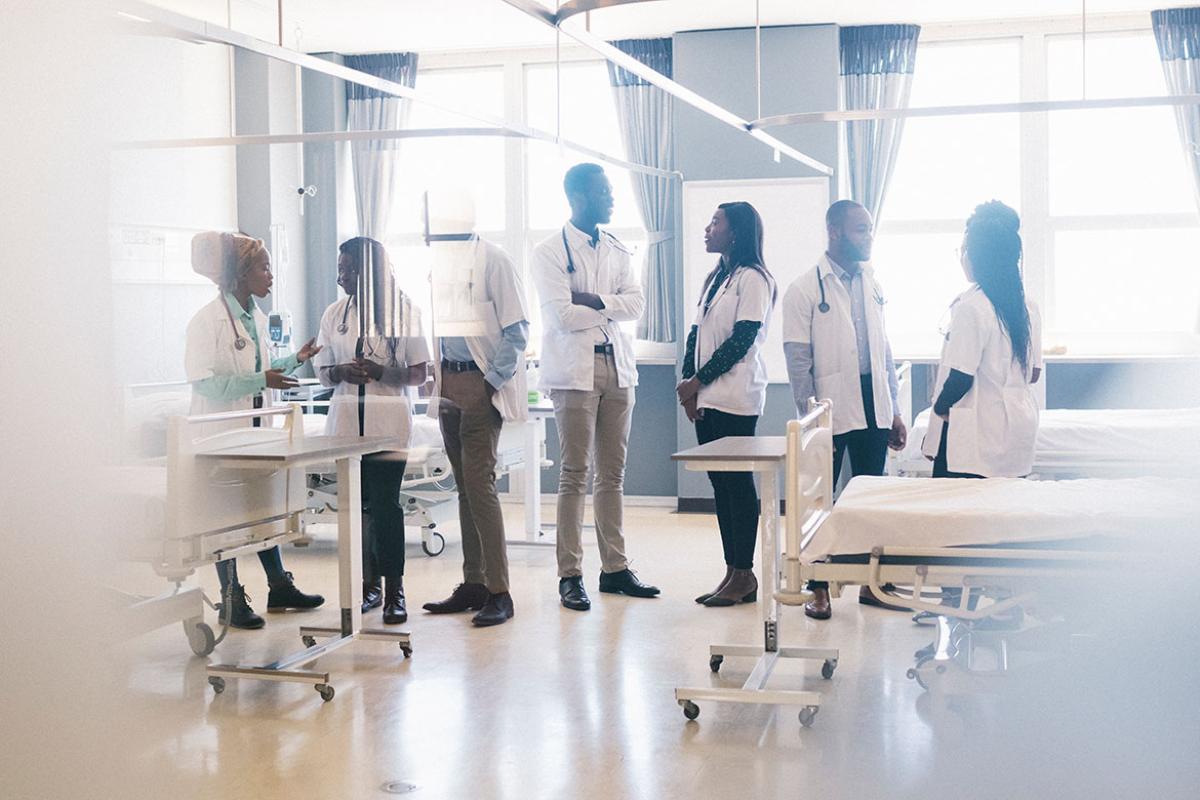 Group of medical students speaking in a hospital