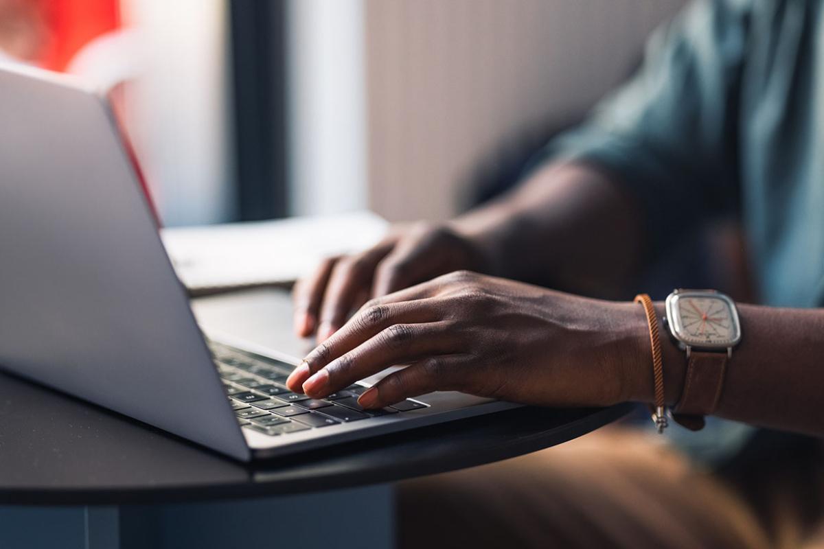 Hands on a laptop
