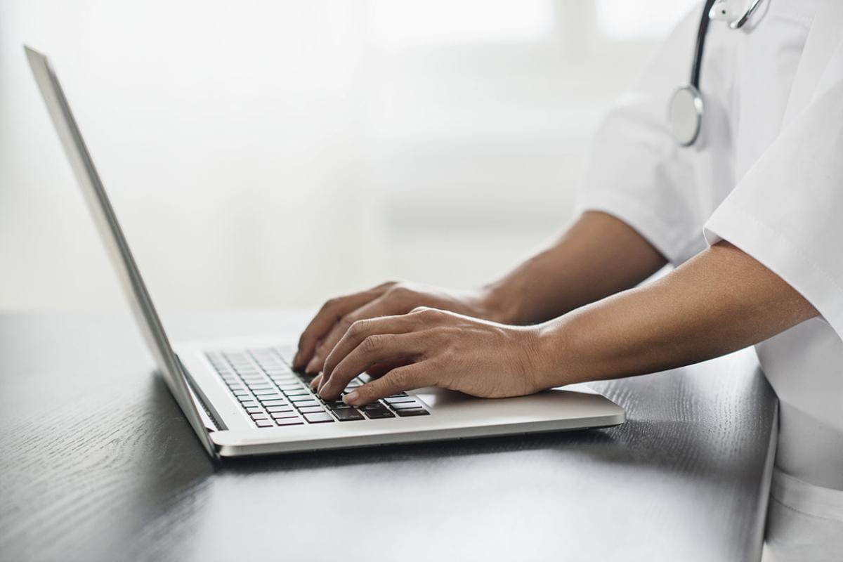 Person typing on laptop