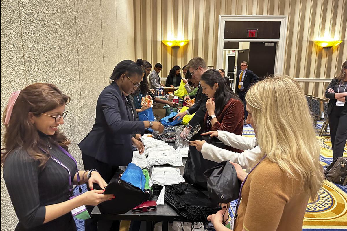 Members of the AMA Medical Student Section assemble care kits for people experiencing houselessness
