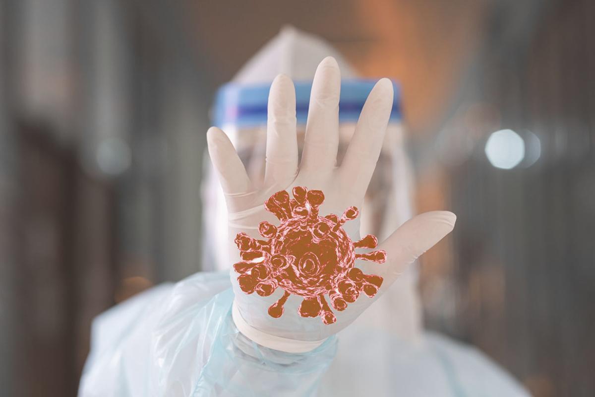 Doctor stand in front of the corona virus or COVID-19 with rejection gesture