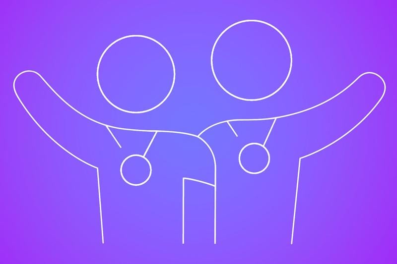 Two embracing figures wearing award medals