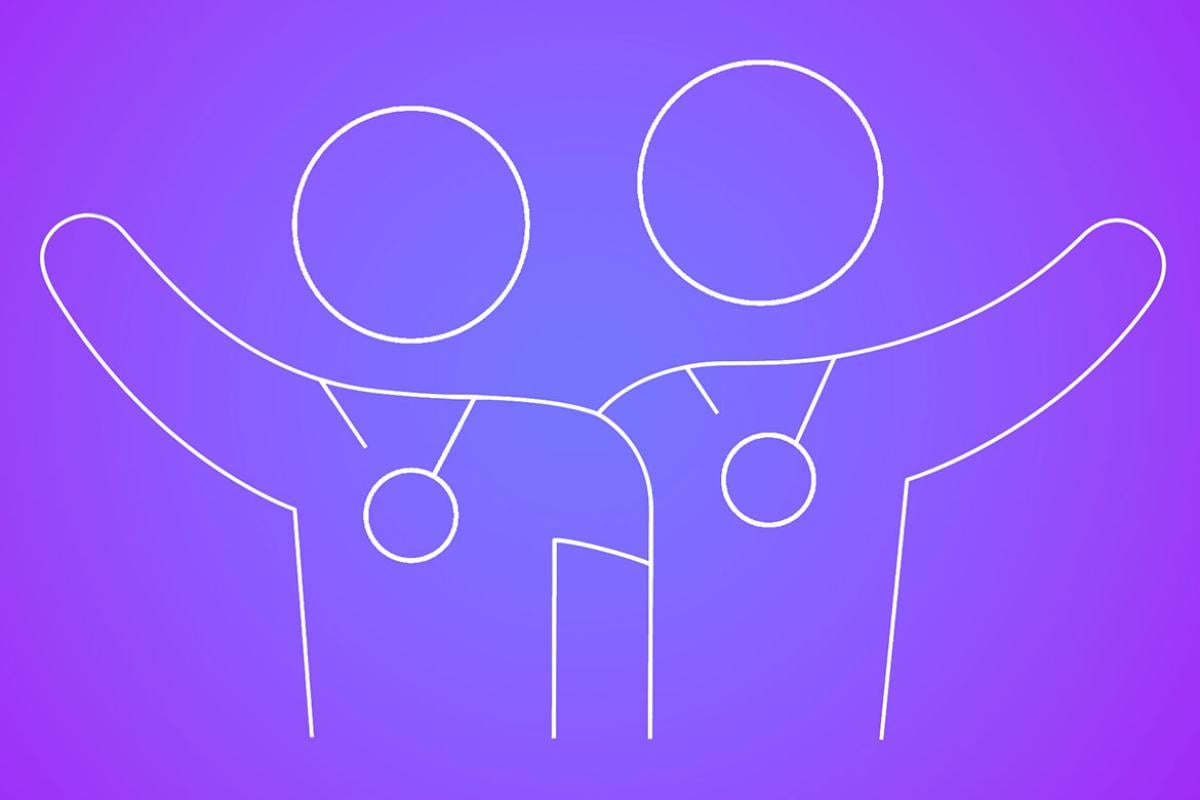 Two embracing figures wearing award medals