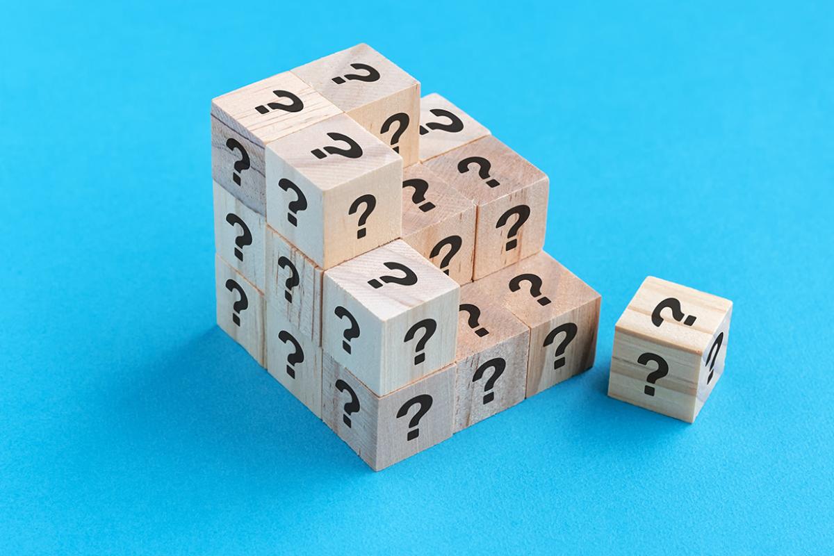 Stacked blocks stamped with question marks