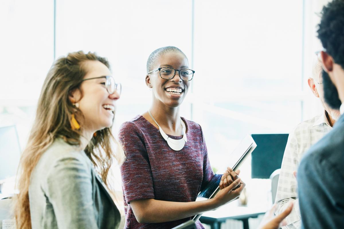 Group of people talk in an office