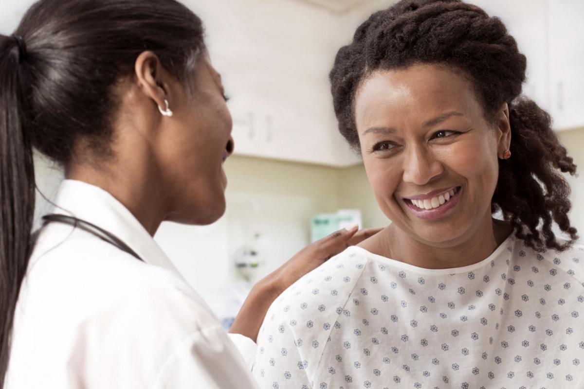 Physician counseling smiling patient