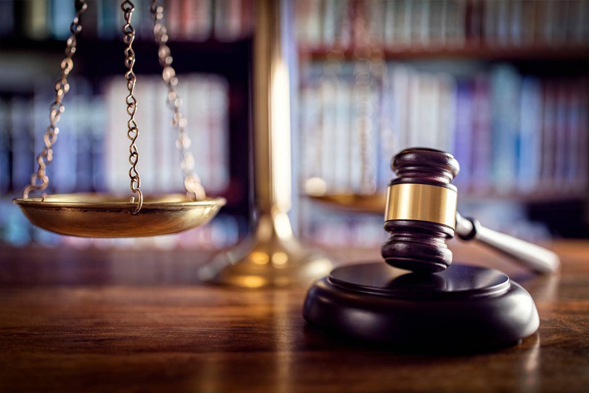 Gavel and scales on table