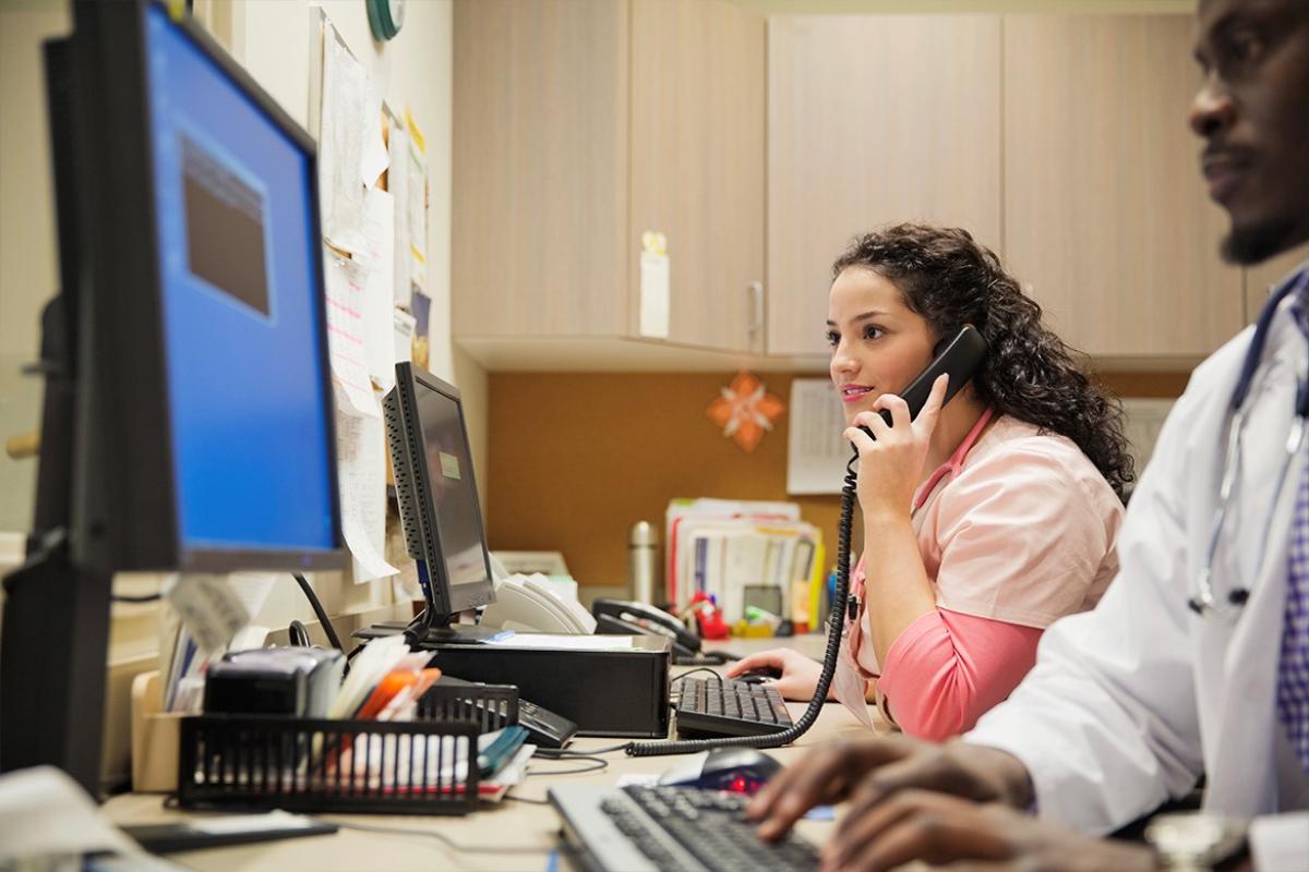 Health care professionals working in a small private practice office.